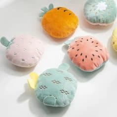 Colorful plush fruit-themed cushions including strawberry, pineapple, kiwi, and watermelon designs, ideal for home decor, cozy comfort, or children's accessories. Perfect for adding playful charm to any space.