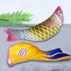 Fish-shaped decorative pillow with colorful abstract patterns for home decor.