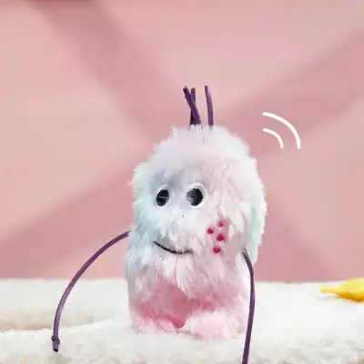 Lofi cute fluffy plush toy character with purple horns on pink background, toy resembling a friendly monster, ideal for children's accessories and toys, playful and adorable design.
