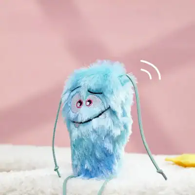 Colorful fluffy plush microphone toy with a winking face and smile, perfect for kids' toys or fun gifts.