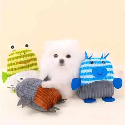 Fluffy white puppy surrounded by colorful plush aquatic animal toys, ideal for pet products or playful accessories, on a neutral background.
