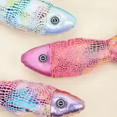 Colorful holographic fish-shaped plush toys with shiny, iridescent scales and button eyes, perfect for children's decor, plush collectibles, or gift items at Monalisa Medical Store.