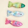 Colorful fish-shaped plush toys with shiny sequined scales, perfect for children’s entertainment and sensory play. Vibrant designs in green, blue, and pink add a playful touch to any toy collection.