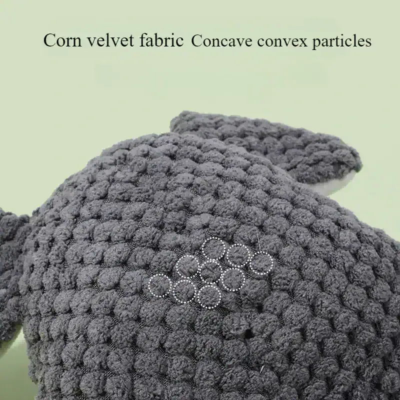 Soft, textured gray fabric of a plush stuffed animal on Monalisa Store's website with the label "Corn velvet fabric.".
