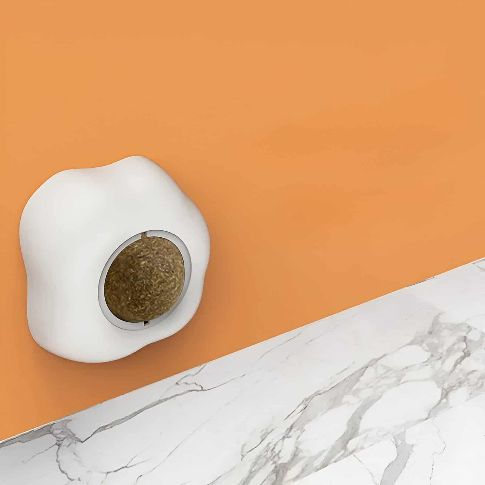 Scent diffuser on a vibrant orange wall, modern home decor, stylish and functional ambient scent diffuser for a cozy atmosphere.