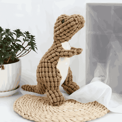 Rugged dinosaur plush toy with soft, textured fabric in a cozy Monalisa Store decor setting. Perfect for kids' room, nursery, or as an adorable gift. Crafted with plush material for comfort and durability.