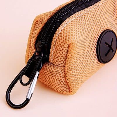 Light orange mesh pouch with black zipper and carabiner clip, ideal for storing small accessories or eyeglasses, featuring a circular logo patch.