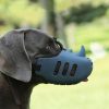 Dog wearing a medical mask, outdoor setting, health and safety, pet protection, clean air for dogs.