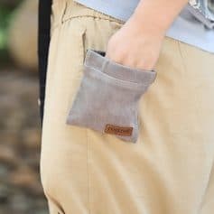 Soft beige wrist support sleeve with a brown leather logo tag, designed for comfort and medical use in opt or healthcare settings.