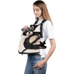 Dog carrier backpack in beige and black, ideal for travel and outdoor activities, featuring comfortable straps and secure enclosure. Perfect for pet owners on the go.