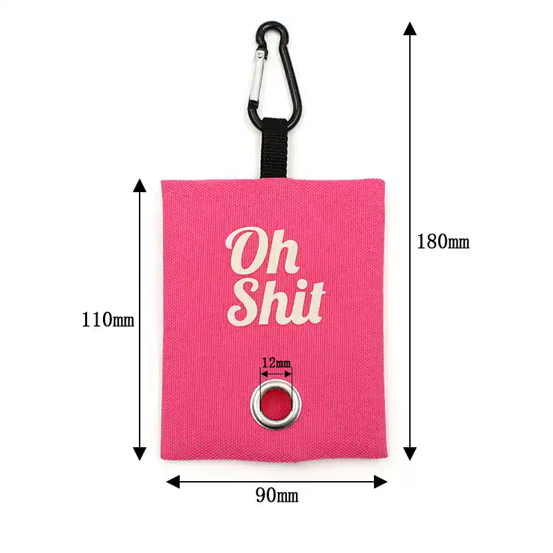 Pink fabric pouch with "Oh Shit" text, metal eyelet, and carabiner clip, ideal for carrying essentials, accessories, or emergency supplies, designed for outdoor and travel use.