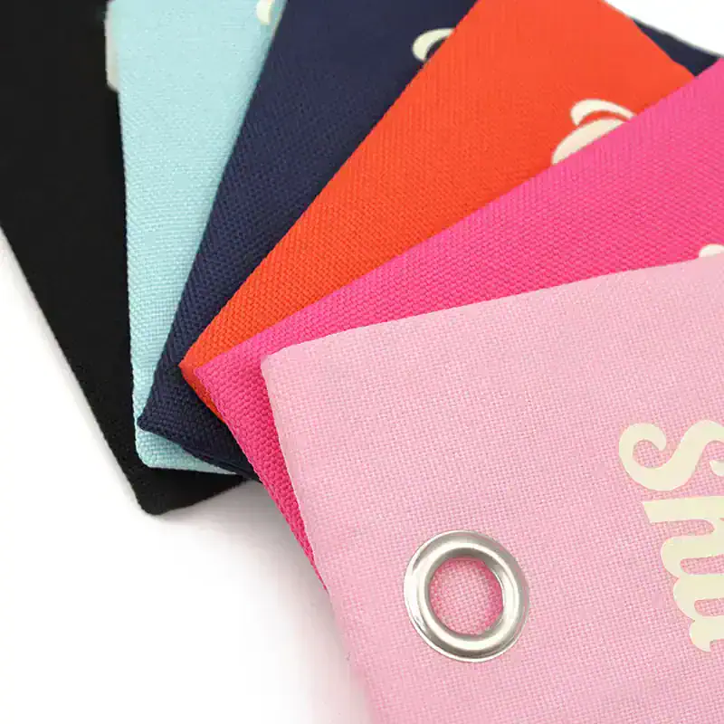 Colorful fabric face masks in pink, orange, navy, light blue, and black, featuring drawstring closures and vibrant designs, available at Monalisa Store for stylish eye protection.