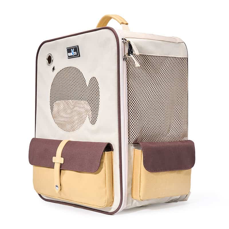 Travel-sized pet carrier with breathable mesh panels and storage pockets, ideal for small pets. Perfect for trips and visits to Meralis Medical stores, ensuring comfort and convenience for your furry friend.