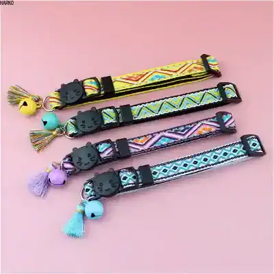 Colorful fabric pet collar with black cat face buckle and decorative charms, perfect for stylish cats and small dogs.