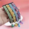 Beaded embroidered pet collar with colorful geometric patterns, adjustable strap, and decorative tassels and bells for stylish dog or cat accessories.