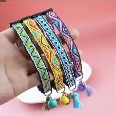 Beaded embroidered pet collar with colorful geometric patterns, adjustable strap, and decorative tassels and bells for stylish dog or cat accessories.