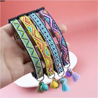 Beaded embroidered pet collar with colorful geometric patterns, adjustable strap, and decorative tassels and bells for stylish dog or cat accessories.