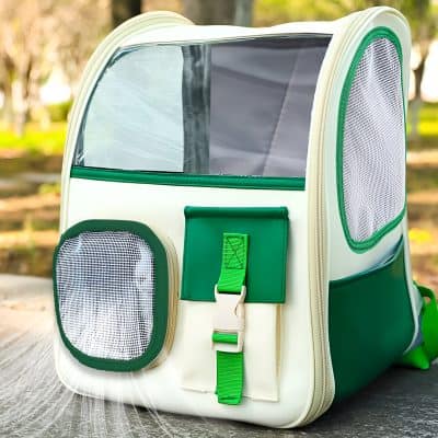 Portable pet travel carrier with ventilation mesh panels and transparent top, perfect for pet transportation and travel safety.