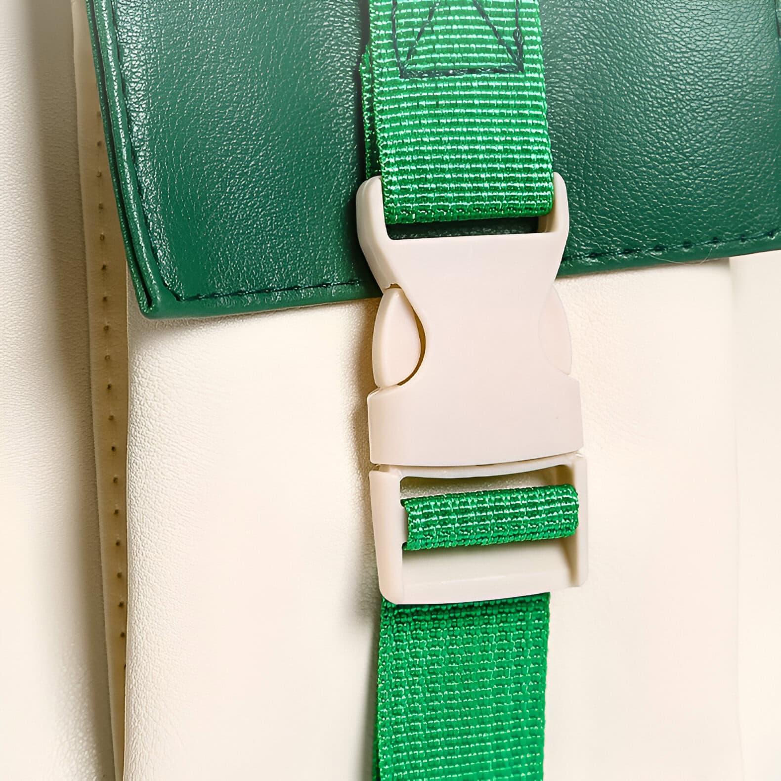 Heavy-duty green strap with white buckle for medical or optometric equipment, designed for secure fastening and support. Durable strap used in optometry clinics, eye care, or medical practice furniture.