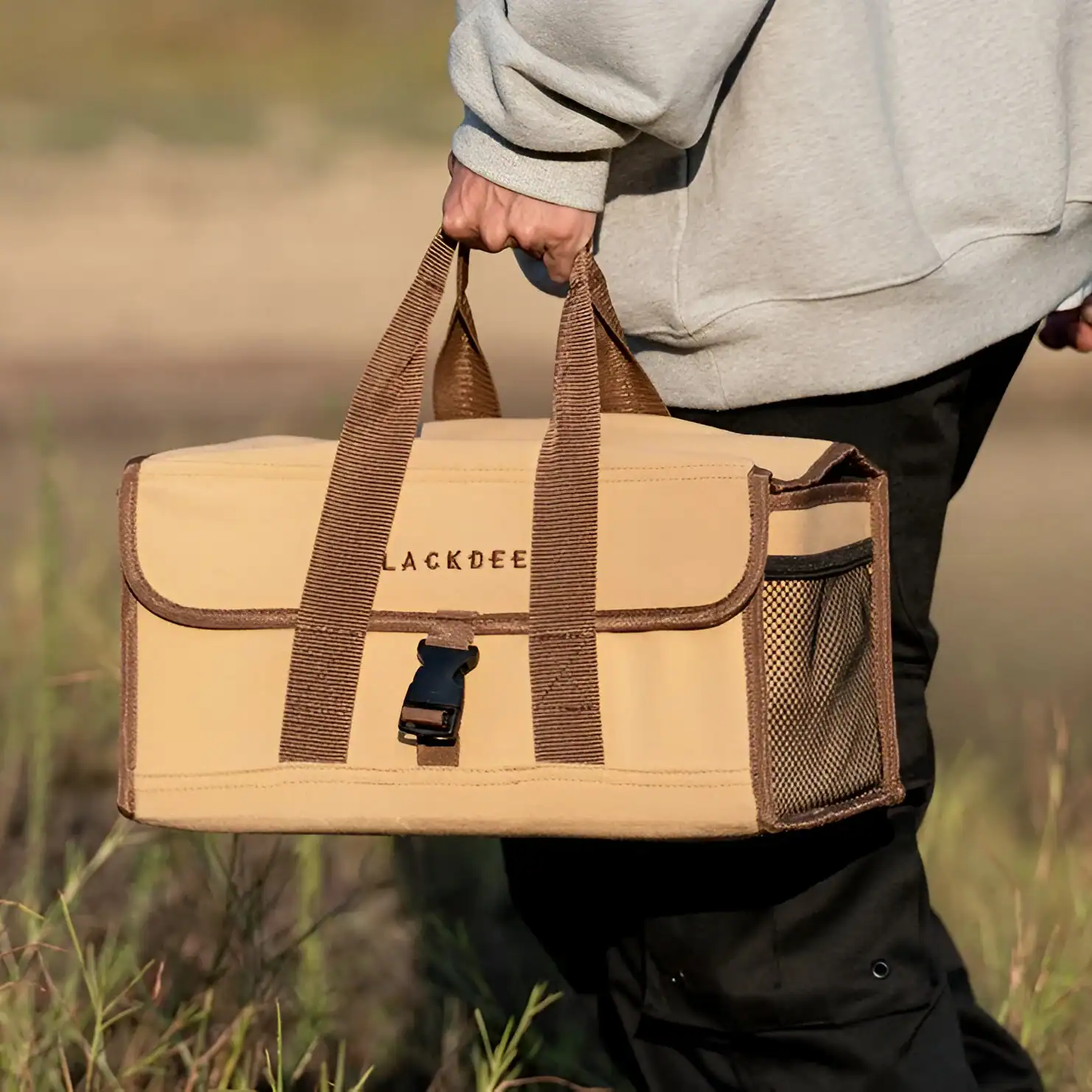 Durable beige carrying case with brown straps, ideal for optical equipment or gadgets, featuring multiple compartments for organization. Perfect for outdoor activities or travel.