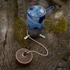 Firewood moisture meter on tree trunk, portable wood moisture tester, moisture measurement tool, ideal for firewood and lumber, ensuring proper dryness for safe burning and storage.