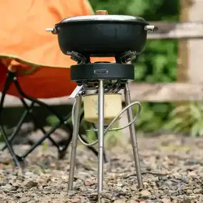 Portable camping stove with cookware for outdoor cooking and camping adventures. Compact, durable, and perfect for outdoor enthusiasts and hiking trips to prepare delicious meals in nature.