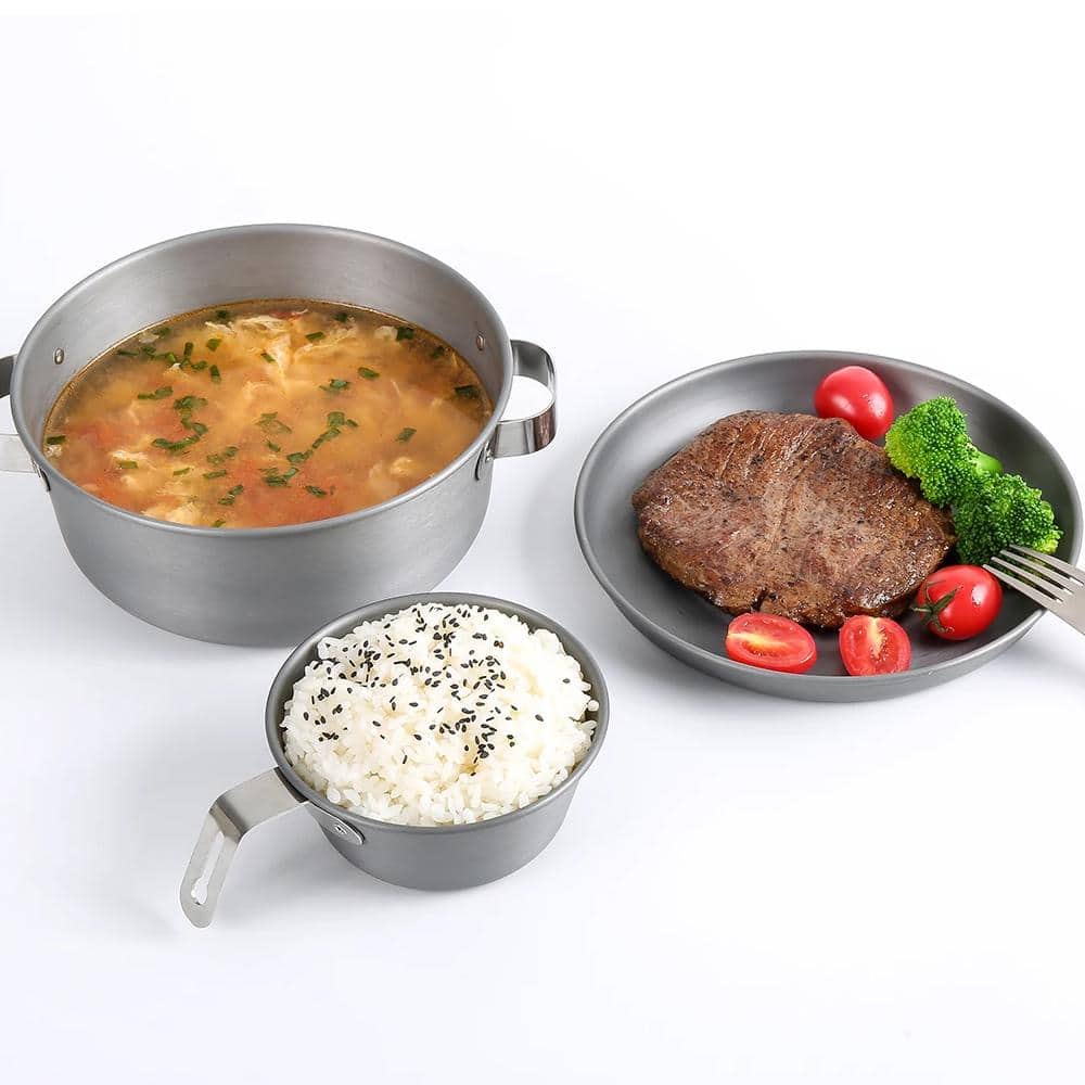 Deluxe stainless steel dinnerware with meat, rice, and soup, perfect for healthy meals and cooking, ideal for kitchen and restaurant settings.
