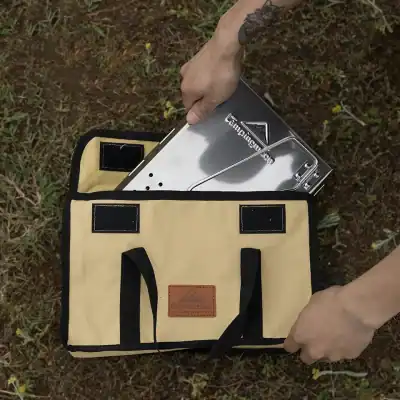 Portable surgical instrument tray in a black and tan carrying case, perfect for medical professionals and clinics.