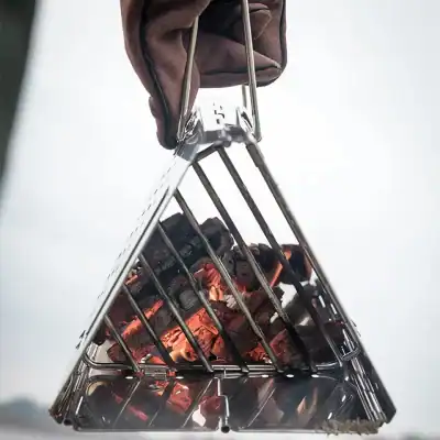 Bbq grill with hot charcoal in a metal basket, ready for outdoor cooking - Monalisa Store.