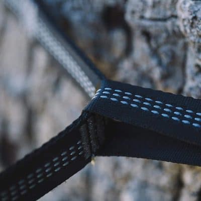 Durable black and blue reflective strap for outdoor sports and safety gear.