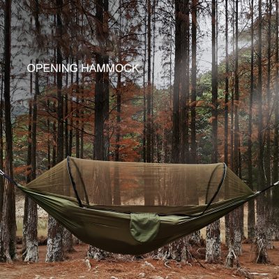 Lightweight outdoor camping hammock set up in a forest, perfect for backpacking and relaxation in nature, featuring durable material and easy installation.