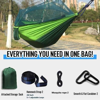 Folding camping hammock with insect net in vibrant green and blue for outdoor relaxation and travel.