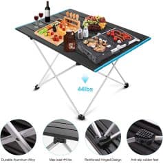 Foldable portable camping table with reinforced hinge, durable aluminum alloy surface, anti-slip rubber feet, and a maximum load capacity of 44 lbs, ideal for outdoor cooking and picnics.