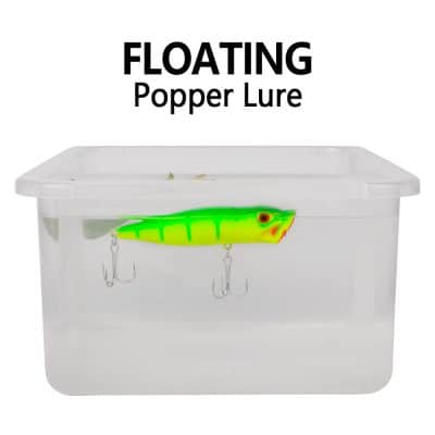 Bright green fishing lure for freshwater and saltwater fishing, floating popper lure ideal for bass and predator fish, includes treble hooks, perfect for fishing tackle collection.