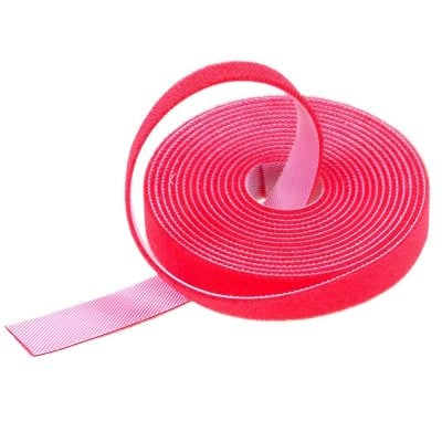 Red medical adhesive strapping tape for wound care and orthopedics, flexible and strong, suitable for sports injuries and support.
