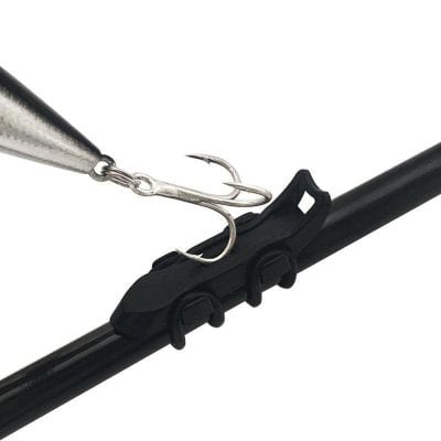 Metal fishing lure with treble hook mounted on a black optical instrument clip, used in fishing accessories and optometric gear images.