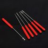 Precision screwdrivers set with red handles for eyeglass and optical repair.