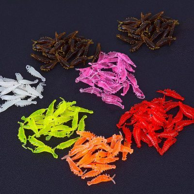 Multi-colored soft plastic fishing lures mimicking small aquatic creatures, used for attracting fish during recreational and professional fishing. Suitable for various fishing environments and techniques.