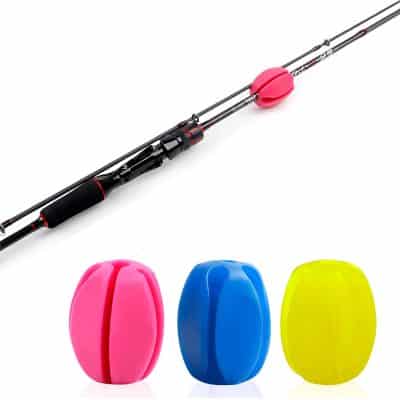 Brightly-colored fishing floats with a fishing rod on white background, ideal for fishing enthusiasts. Durable, lightweight, and effective for fishing success, available at Monalisa Store.