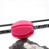 Pink optical lens for sunglasses or eyewear, displayed on a gray rock with a white background. High-quality image showcasing custom eyewear accessories from Monalisa Store.