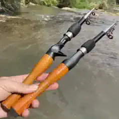 Stainless steel fishing rods with wooden handles for freshwater fishing, lightweight and durable fishing gear. Crafted for anglers enjoying river and stream fishing adventures.