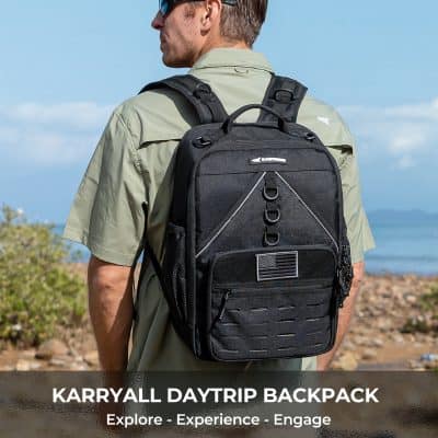 Durable black Karryall daytrip backpack with multiple compartments, ideal for travel, outdoor activities, and everyday use, featuring American flag patch and ergonomic design.