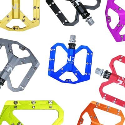 Colorful anodized bicycle pedals with lightweight aluminum construction for enhanced performance and durability. Suitable for mountain biking, road cycling, and professional MTB racing.