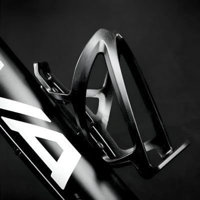 High-performance bicycle water bottle holder attached to a bike frame for cycling enthusiasts.