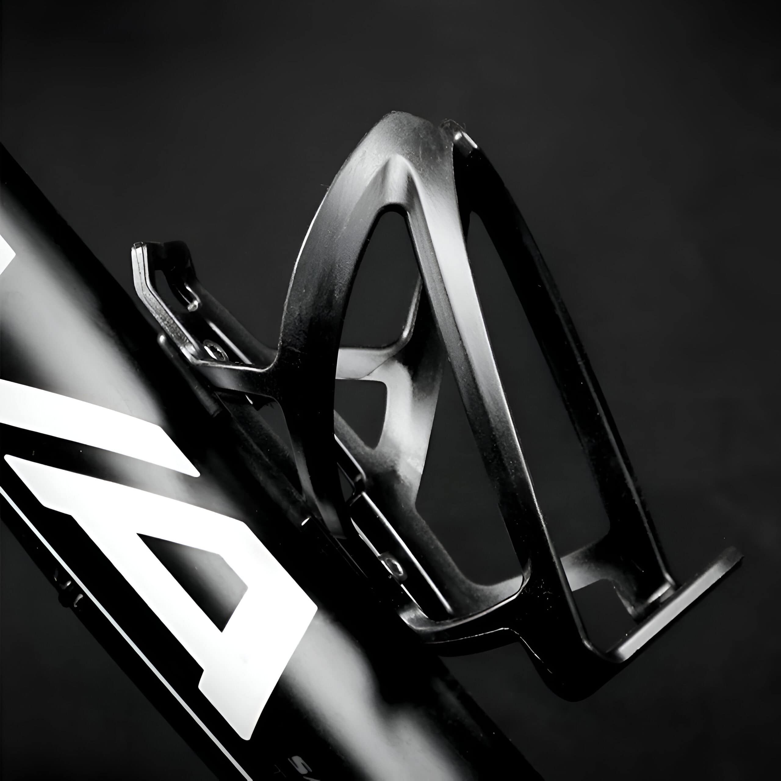 High-performance bicycle water bottle holder attached to a bike frame for cycling enthusiasts.