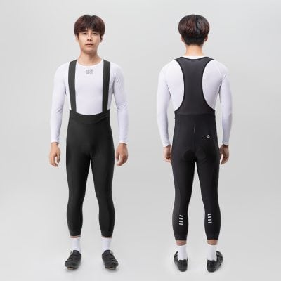 Men's compression sportswear with suspenders, black and white athletic clothing, breathable fabric fit for running and cycling.