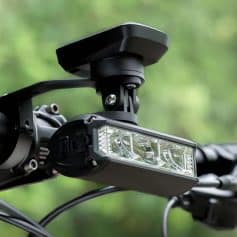 High-quality LED bike headlight mounted on handlebars with adjustable mount for optimal illumination, ideal for cycling safety and outdoor adventures.