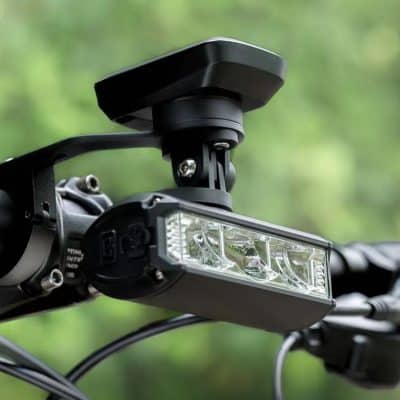 High-quality LED bike headlight mounted on handlebars with adjustable mount for optimal illumination, ideal for cycling safety and outdoor adventures.