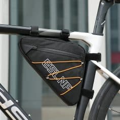 Waterproof bike saddlebag with reflective logo and orange bungee cords for secure storage, mounted on a modern bicycle for convenient on-the-go cycling essentials.