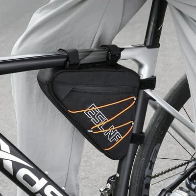 Sturdy black and orange cycling saddlebag attached to a modern bicycle frame, perfect for bike touring and essentials storage during outdoor adventures.